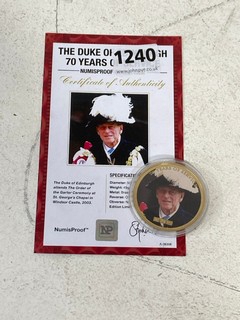 A 24 CARAT GOLD PLATED BRASS COMMEMORATIVE COIN, HRH THE DUKE OF EDINBURGH, 70 YEARS OF SERVICE, WITH EDITION CERTIFICATE: LOCATION - BR1