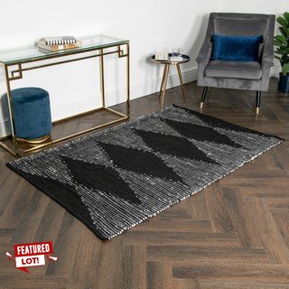 LEA DIAMOND DESIGN LEATHER AND COTTON FLOOR RUG IN BLACK/GREY : SIZE 120 X 180CM - RRP £130: LOCATION - CR8