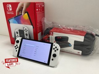 NINTENDO SWITCH OLED MODEL 64GB GAMES CONSOLE IN WHITE: MODEL NO HEG-001 (WITH BOX & ALL ACCESSORIES, TO INCLUDE NINTENDO SWITCH DELUXE TRAVEL CASE) [JPTM120580] THIS PRODUCT IS FULLY FUNCTIONAL AND