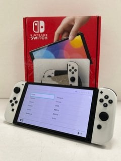 NINTENDO SWITCH OLED MODEL 64GB GAMES CONSOLE IN WHITE: MODEL NO HEG-001 (WITH BOX & ALL ACCESSORIES, MINOR COSMETIC IMPERFECTIONS ON BODY OF CONSOLE (PICTURED)) [JPTM121716] THIS PRODUCT IS FULLY FU