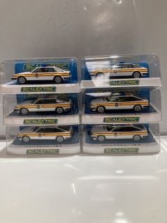 AN ASSORTMENT OF CAR TOYS INC SCALEXTRIC ROVER SD1-POLICE EDITION C4342 WHITE