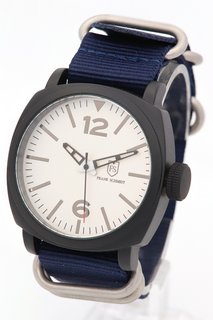 MEN'S FRANK SCHMIDT WATCH. FEATURING A WHITE PILOT DIAL, BLACK BEZEL AND CASE, W/R 3ATM. BLUE FABRIC STRAP. COMES WITH A PRESENTATION CASE: LOCATION - A1