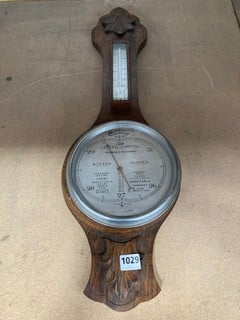 A VINTAGE BANJO PATTERN WALL HUNG BAROMETER: LOCATION - BR10