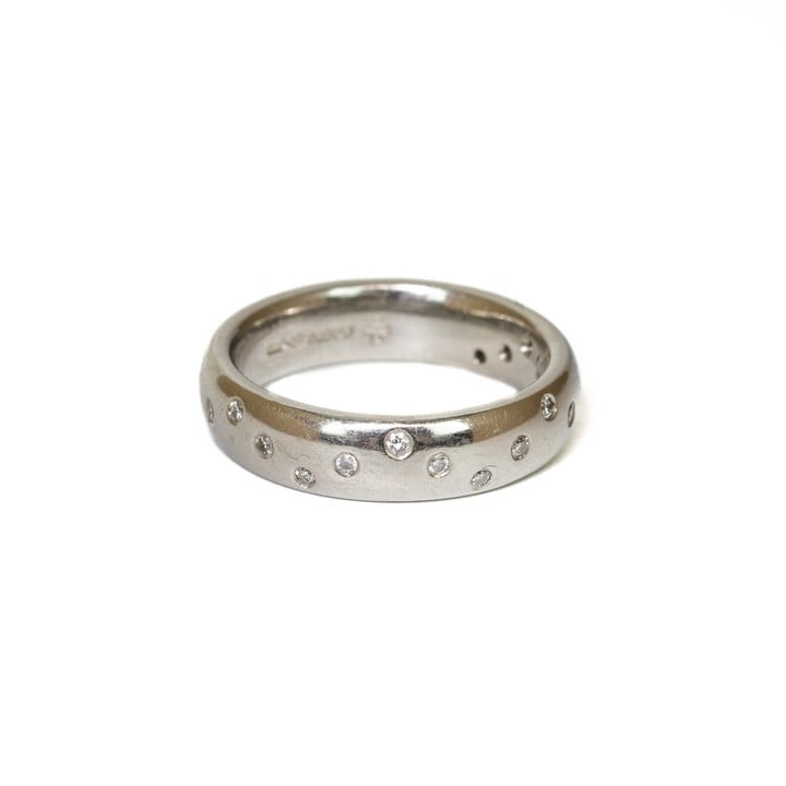 Platinum 950 0.17ct Diamond Wave Band Ring, Size N, 11g.  Auction Guide: £250-£350 (VAT Only Payable on Buyers Premium)