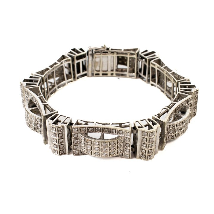 9ct White Gold Hinge Link Diamond Bracelet, 21cm, 54.4g. Auction Guide: £950-£1,150 (VAT Only Payable on Buyers Premium)