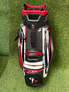 STROMBERG GOLF BAG IN RED WHITE & BLACK TO INCLUDE QTY OF ASSORTED GOLF CLUBS: LOCATION - C4