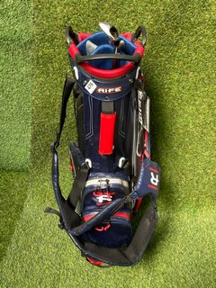 RIFE GOLF BAG IN RED WHITE & BLUE TO INCLUDE 5 IRON: LOCATION - C4