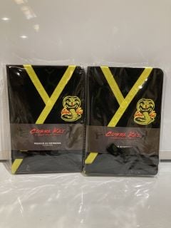 QTY OF ITEMS INCLUDING COBRA KAI PREMIUM A5 NOTEBOOK