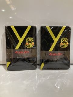 QTY OF ITEMS INCLUDING COBRA KAI PREMIUM A5 NOTEBOOK