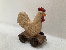 24 X STONE THE CROWS SM.PAIR OF COCK & HEN ON WHEELS - LENGTH 12CM - TOTAL RRP £1320