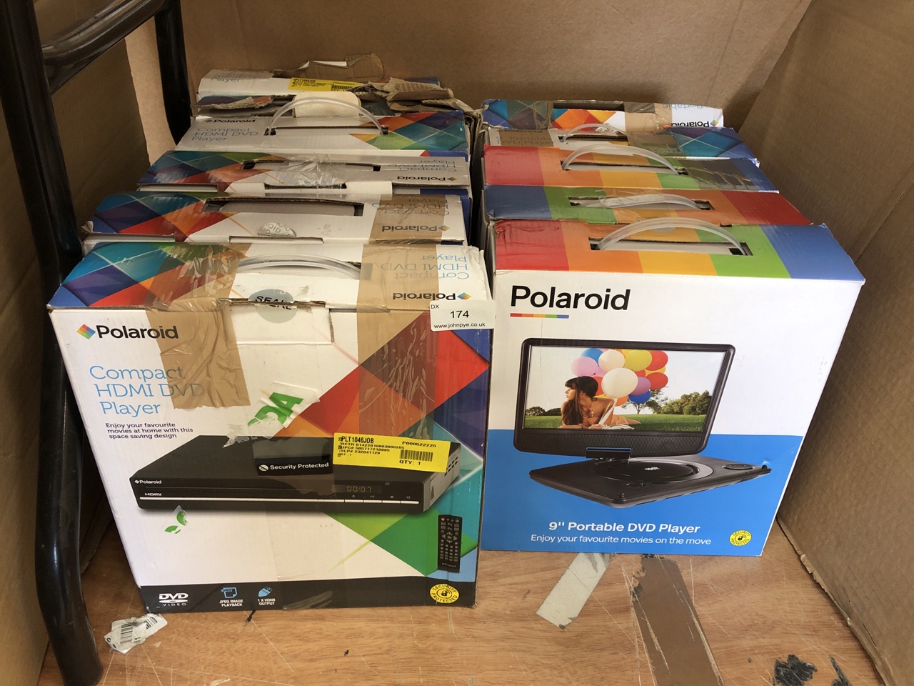 QUANTITY OF ASSORTED DVD PLAYERS TO INCLUDE POLAROID 9" PORTABLE DVD PLAYER: LOCATION - REAR LEFT TABLES(COLLECTION OR OPTIONAL DELIVERY AVAILABLE)