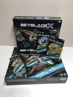 2 X BEYBLADE GAME SETS AND FOUR ADDITIONAL PACKS