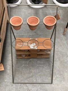 NKUKU JARA TERRACOTTA PLANTER STAND IN TERRACOTTA AND IRON FINISH: LOCATION - B5