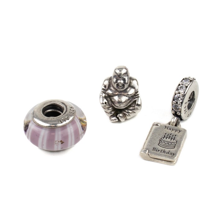 Pandora Silver Three Charms including Buddha, Clear Stone Happy Birthday Card, Pink and White Glass Bead, total weight 10.2g (VAT Only Payable on Buyers Premium)