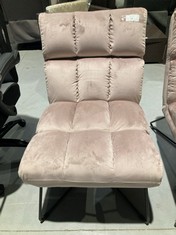 PINK LOUNGE CHAIR WITH BLACK METAL LEGS.