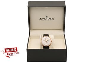 JUNGHANS MEISTER MEN'S CHRONOGRAPH AUTOMATIC WATCH. FEATURING A WHITE MULTI FUNCTIONAL DIAL, ROSE GOLD COLOURED BEZEL AND EXHIBITION CASE, DAY/DATE, W/R 50ATM, LEATHER STRAP. COMES IN A PRESENTATION