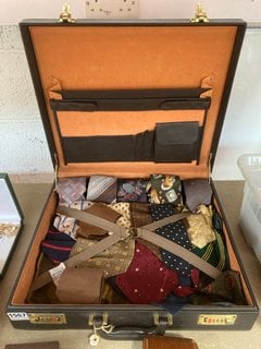 A LEATHER BRIEFCASE WITH A COLLECTION OF VINTAGE TIES: LOCATION - AR9