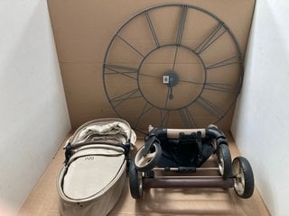 EGG STROLLER IN CREAM TO INCLUDE LARGE METAL WALL CLOCK: LOCATION - BR8