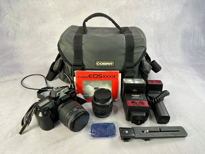 Canon EOS 1000F 35mm Camera With Bag, 2x Sigma Lenses And Other Accessories (VAT ONLY PAYABLE ON BUYERS PREMIUM)