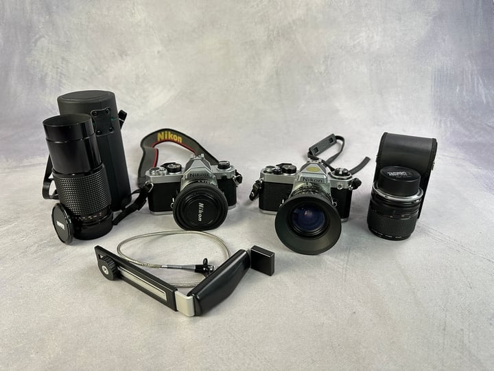 Vintage Nikon Cameras FE3473201 & FM2153865 With Lenses And 2x Extra Lenses And Other Accessories (VAT ONLY PAYABLE ON BUYERS PREMIUM)