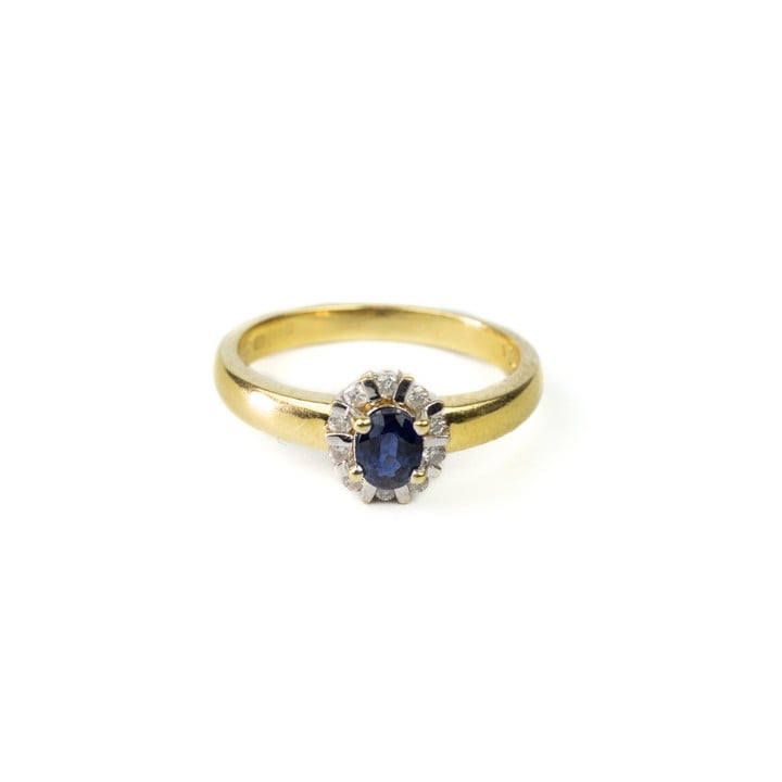 18ct Yellow Gold Blue Stone with Diamond Halo Ring, Size M, 4.3g.  Auction Guide: £200-£300 (VAT Only Payable on Buyers Premium)