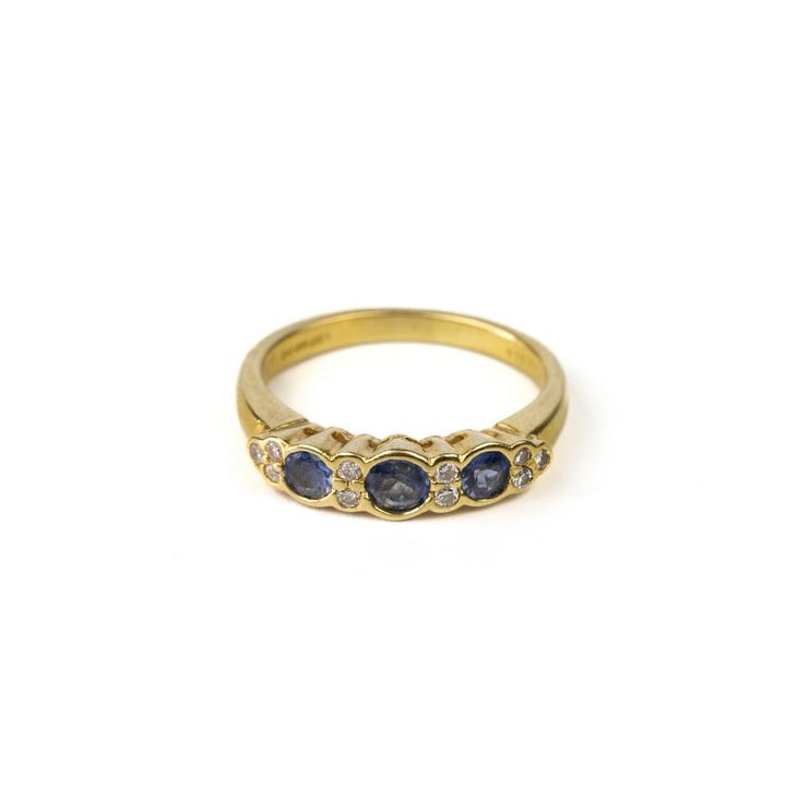 18ct Yellow Gold 0.10ct Diamond with Three Blue Stones Ring, Size L, 3.9g.  Auction Guide:  Auction Guide: £200-£300 (VAT Only Payable on Buyers Premium)