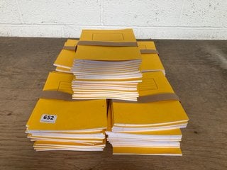 QTY OF A5 LINED WORK BOOKS IN YELLOW: LOCATION - G9