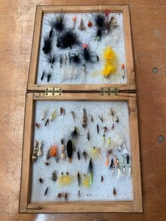 A DOUBLE LIDDED BOX OF FISHING FLIES: LOCATION - CR