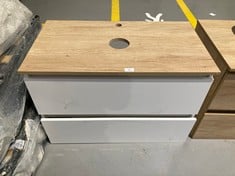 OAK AND WHITE BATHROOM CABINET WITH TWO DRAWERS.