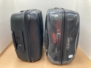 SAMSONITE LARGE HARD SHELL COMBINATION LOCK SUITCASE IN BLACK TO ALSO INCLUDE AMERICAN TOURISTER LARGE HARD SHELL WHEELED COMBINATION LOCK SUITCASE IN BLACK: LOCATION - H7