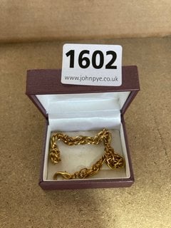 A GOLD COLOURED BRACELET: LOCATION - AR3