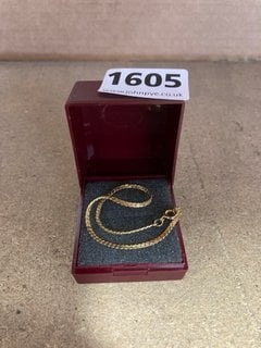 A GOLD COLOURED BRACELET: LOCATION - AR3