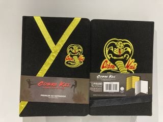 BOX OF ASSORTED ITEMS TO INCLUDE COBRA KAI NOTEPAD