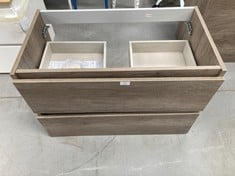 WALL-MOUNTED BATHROOM CABINET WITH TWO WOODEN DRAWER UNITS.