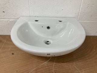 A TWO TAP HOLE CERAMIC BATHROOM BASIN