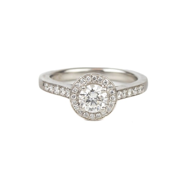 Platinum 950 0.80ct Diamond Round Brilliant-cut with Halo and Shoulders Ring, Size J½, 6.2g. Colour I-J, Clarity VS1-VS2.  Auction Guide: £450-£550 (VAT Only Payable on Buyers Premium)