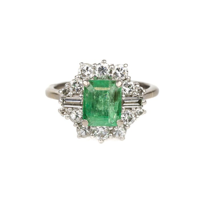 18K White 0.80ct Emerald and 0.36ct Diamond Halo Ring, Size J½, 4.9g.  Auction Guide: £250-£350 (VAT Only Payable on Buyers Premium)