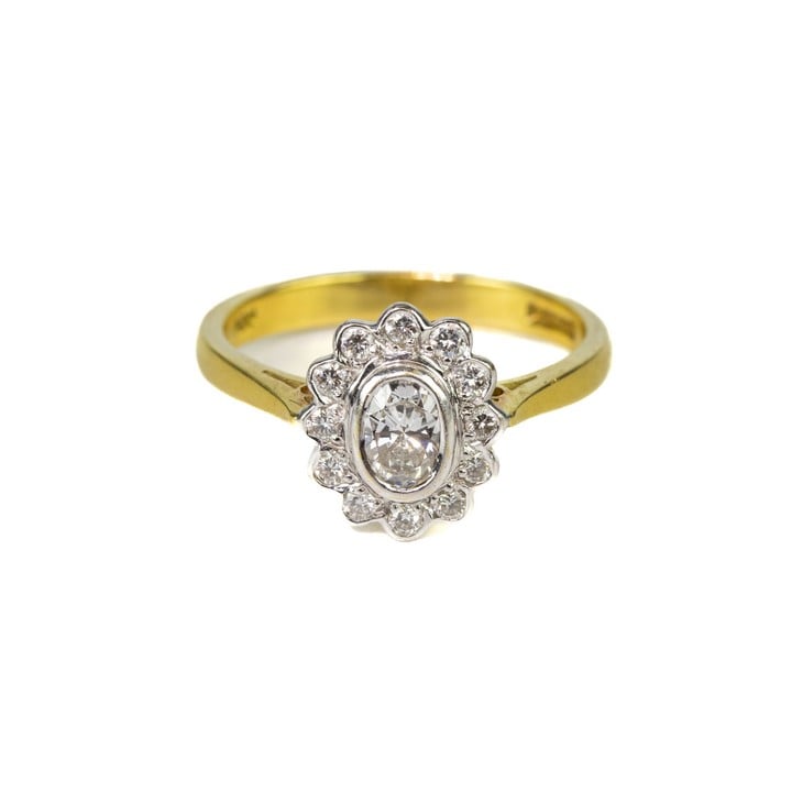 18ct Yellow and White Gold Oval-cut Diamond with Diamond Halo Ring, Size M, 3.6g.  Auction Guide: £350-£450 (VAT Only Payable on Buyers Premium)