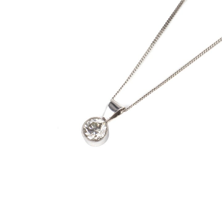 14ct White Gold 0.75ct Diamond Round Brilliant-cut Pendant and Fine Curb Chain, 50cm, 3g. Colour K-L, Clarity VS1-VS2.  Auction Guide: £450-£550 (VAT Only Payable on Buyers Premium)