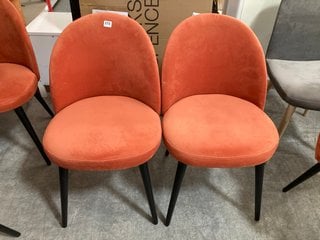 PAIR OF CONTEMPORARY MODERN STYLE UPHOLSTERED DINING CHAIRS IN BURNT ORANGE PLUSH VELVET AND BLACK LEGS: LOCATION - C4