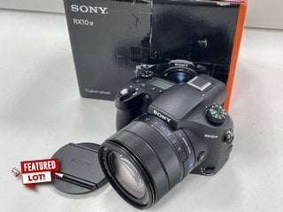 SONY RX10 IV BRIDGE CAMERA (ORIGINAL RRP - £1499). (WITH BOX, BATTERY, CHARGER, LENS CAP & HOOD) [JPTM124983]. THIS PRODUCT IS FULLY FUNCTIONAL AND IS PART OF OUR PREMIUM TECH AND ELECTRONICS RANGE