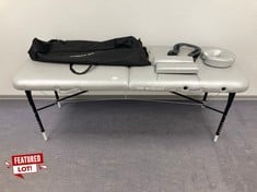 WELLCORE MASSAGE TABLE WITH ACCESSORIES AND GREY COVER.