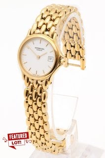 RAYMOND WEIL CHORUS 5368 LADIES WATCH. FEATURING A WHITE ROMAN NUMERAL DIAL, GOLD COLOURED BEZEL AND CASE, DATE, W/R 3ATM, GOLD COLOURED BRACELET (NOT IN ORIGINAL BOX) - ORIGINAL RRP £1195: LOCATION