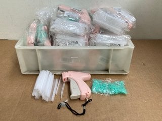 QTY OF STITCHY QUICK TACKING GUN CLOTHING FIXER IN PINK: LOCATION - H13