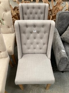 PAIR OF CONTEMPORARY STYLE WING BUTTON BACK DINING CHAIRS IN LIGHT STONE GREY FABRIC WITH OAK LEGS: LOCATION - A5