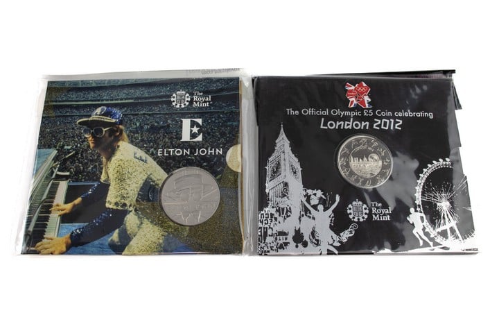 The Royal Mint The Official Olympic £5 Coin Celebrating London 2012 and Elton John 2020 £5 Brilliant Uncirculated Coin, both come with presentation booklets. (VAT Only Payable on Buyers Premium)