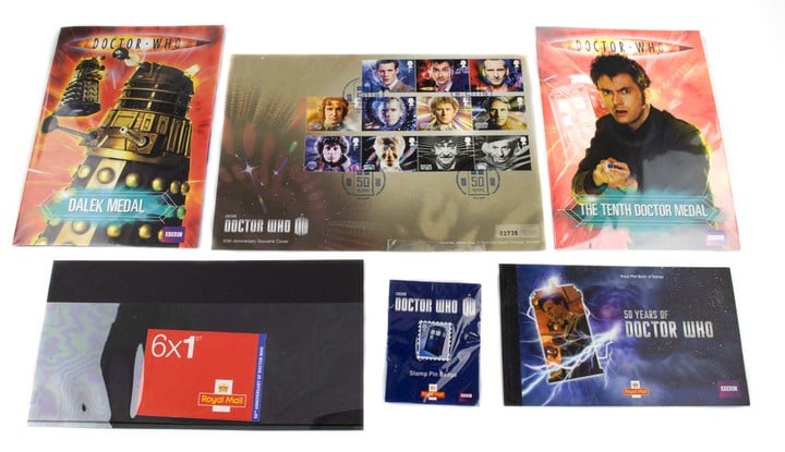 Selection of Doctor Who Memorabilia, including three medals, six stamp collections, Postcards and a Badge. (VAT Only Payable on Buyers Premium)