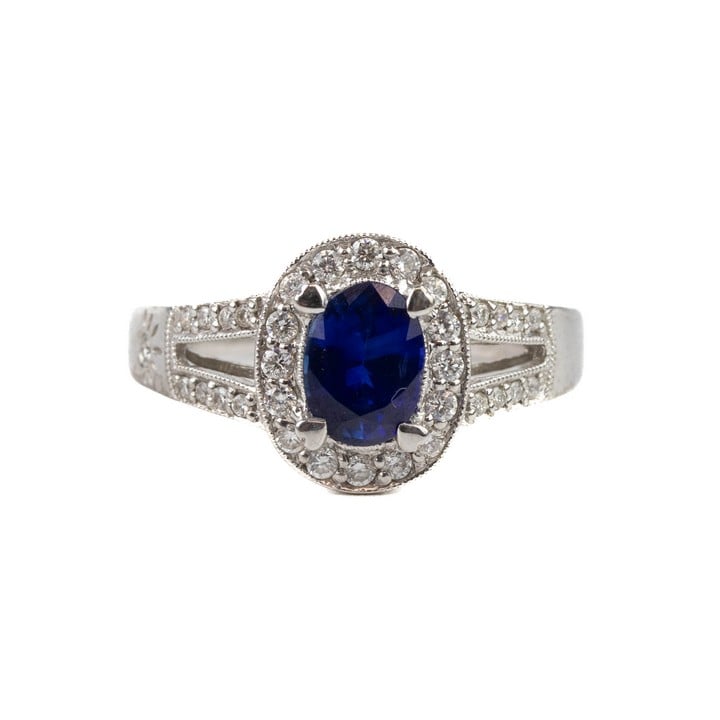 18ct White Gold 0.75ct Sapphire with Diamond Halo and Shoulders Ring, Size L½, 5.2g. (VAT Only Payable on Buyers Premium)