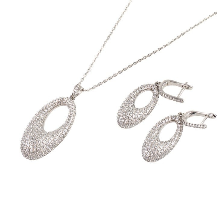 Silver Oval Clear Stone Pavé Cluster Pendant, 4x1.5cm with Chain, 44cm. Matching Pair of Earrings, 4x1.3cm, total weight 12.6g (VAT Only Payable on Buyers Premium)