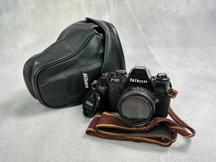 Nikon F-301 35mm SLR Camera With Nikkor 50mm 1:1.8D lens And Case (M0819D040423) (VAT ONLY PAYABLE ON BUYERS PREMIUM)